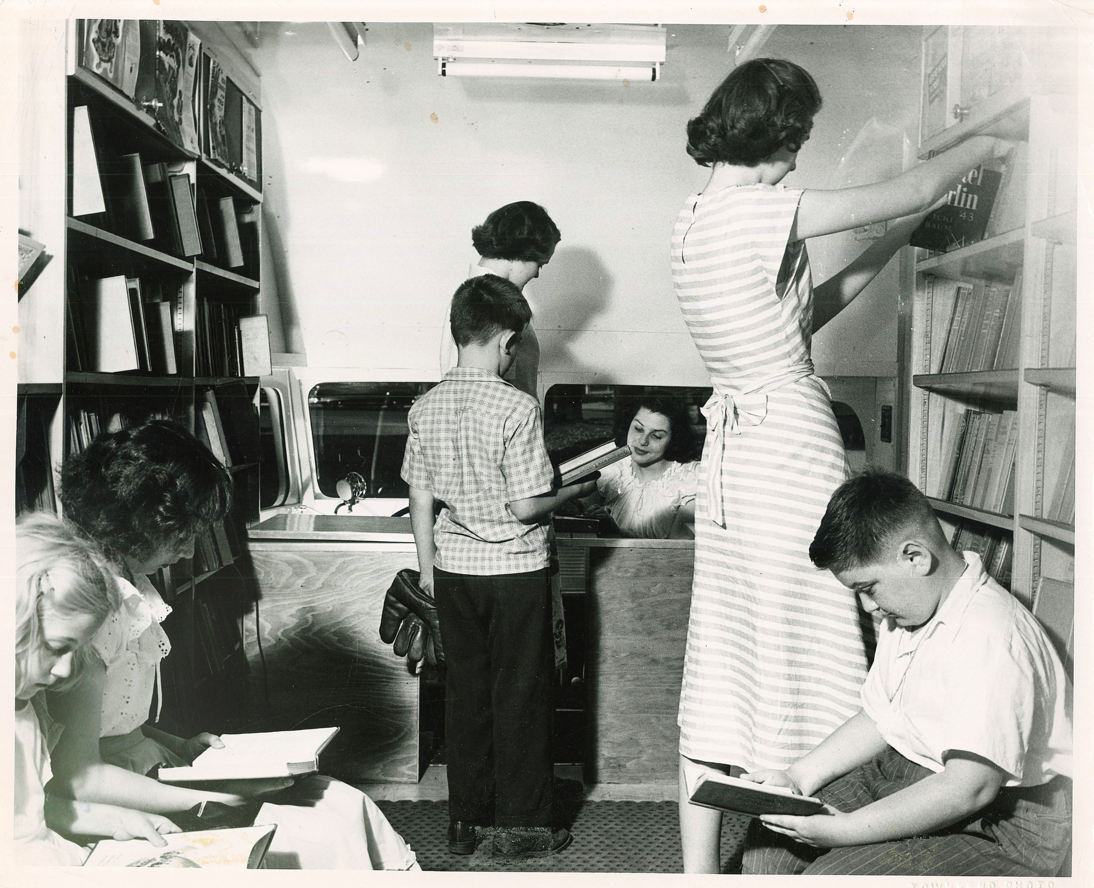 1949 - Library Pages reshelving books on bookmobile